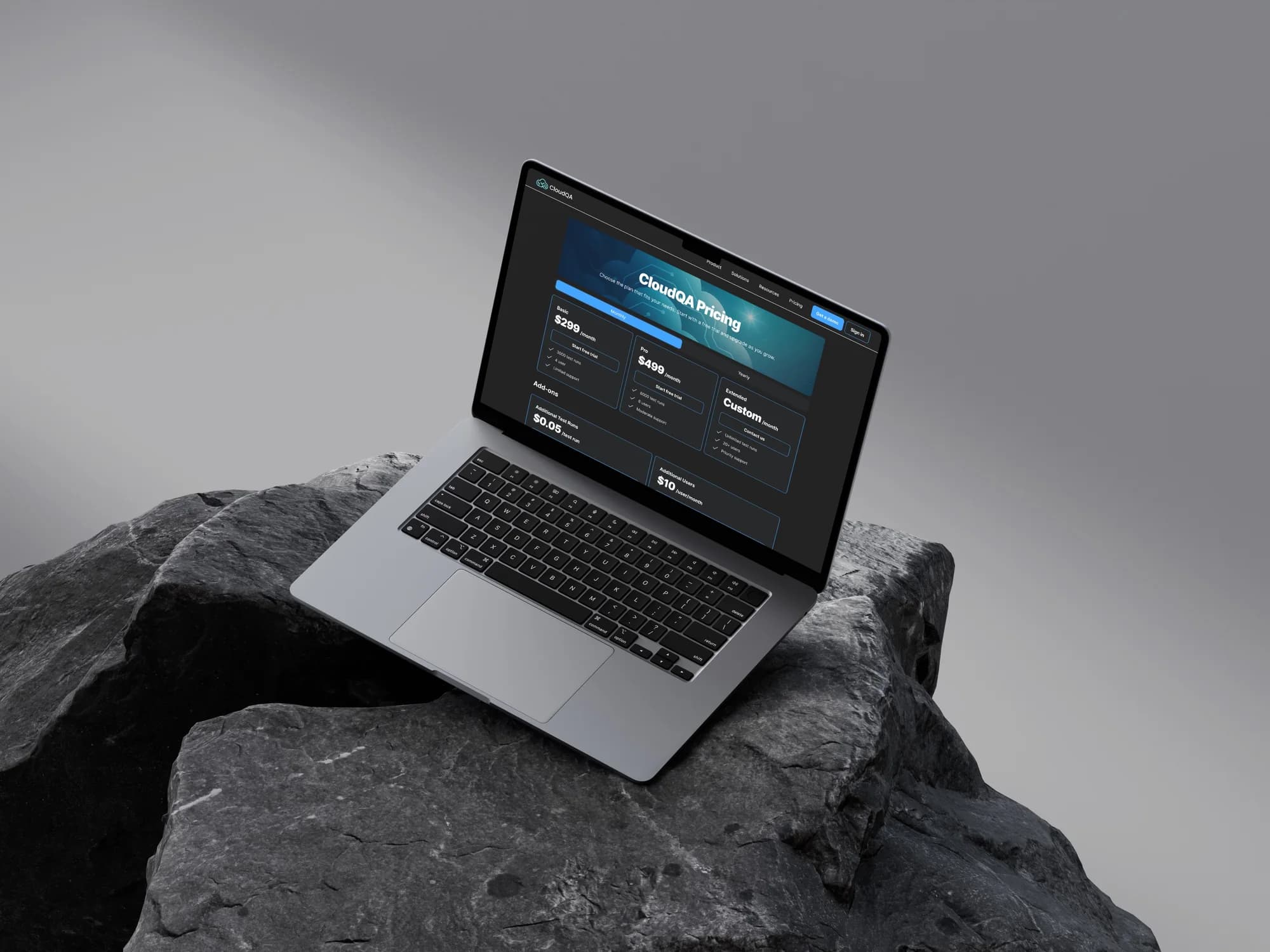 The pricing page on a laptop outdoors